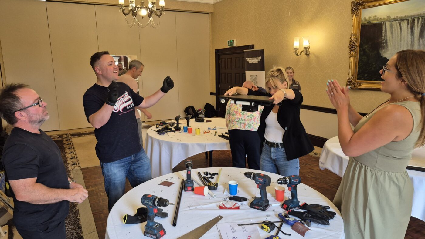 Corporate team building at West Midlands Safari Park with colleagues creating animal enrichment items that support wildlife welfare as part of a CSR‑focused activity