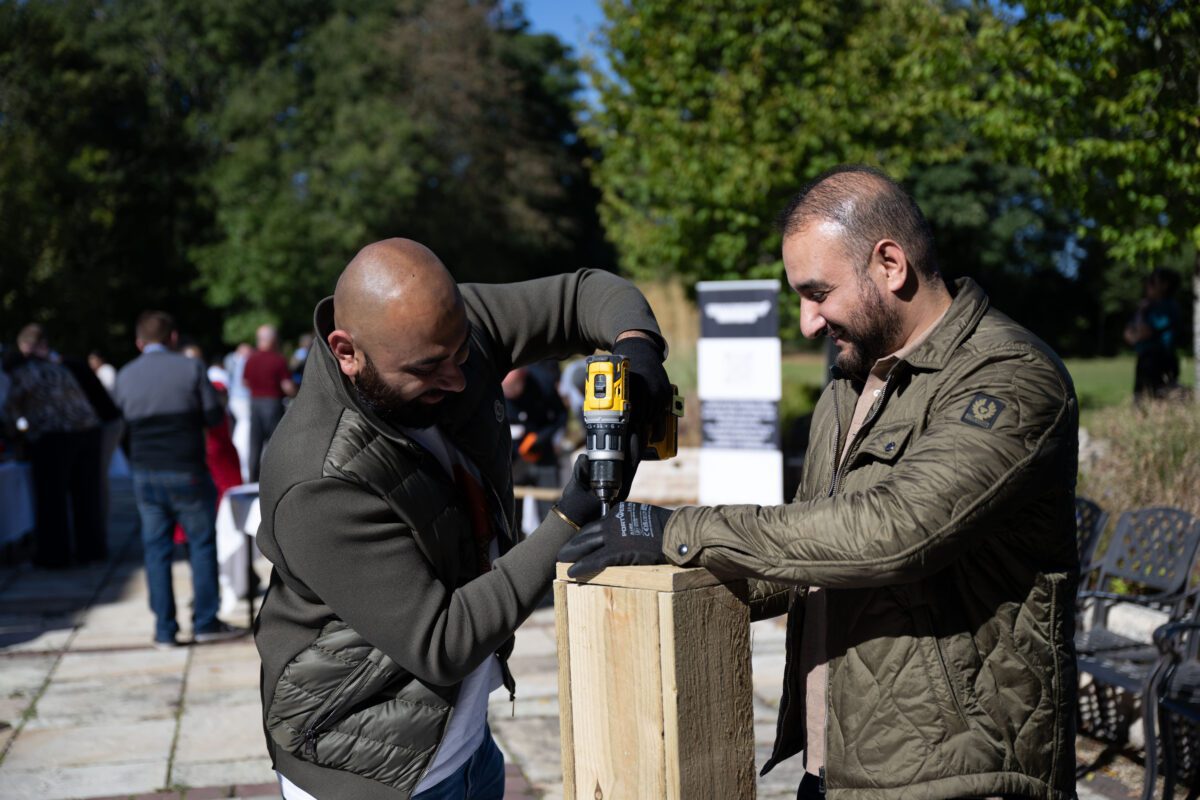 Corporate team building at West Midlands Safari Park with colleagues creating animal enrichment items that support wildlife welfare as part of a CSR‑focused activity